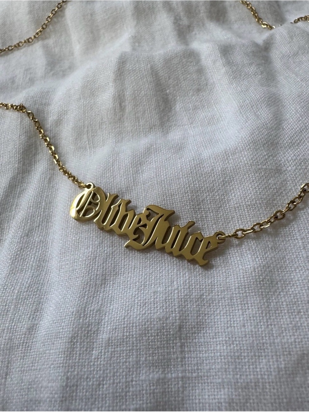 OLIVE JUICE martini gothic font IP gold
Plated necklace